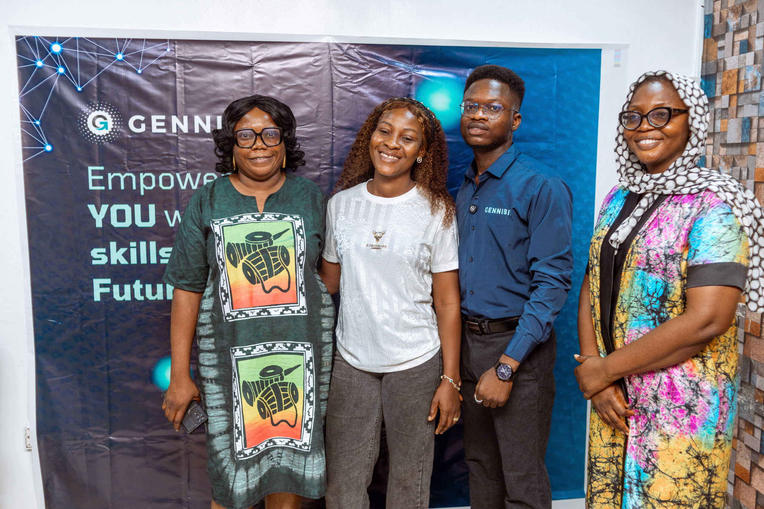 Adeleke Samuel with GenniBit AMBA students posing together for a group photo at the end of the Meetup.