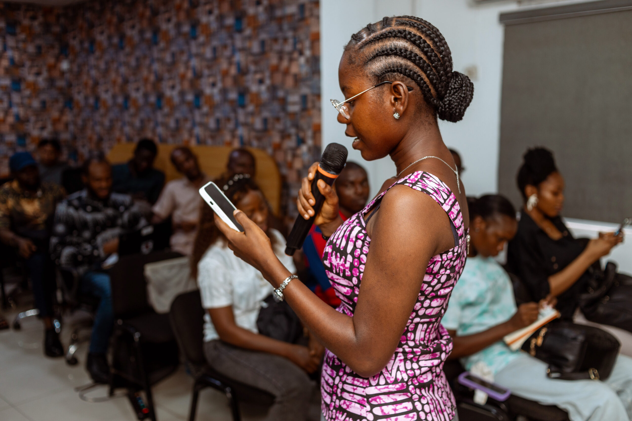 Candid moment capturing gratitude and community spirit among attendees at GenniBit MeetUp Nigeria.
