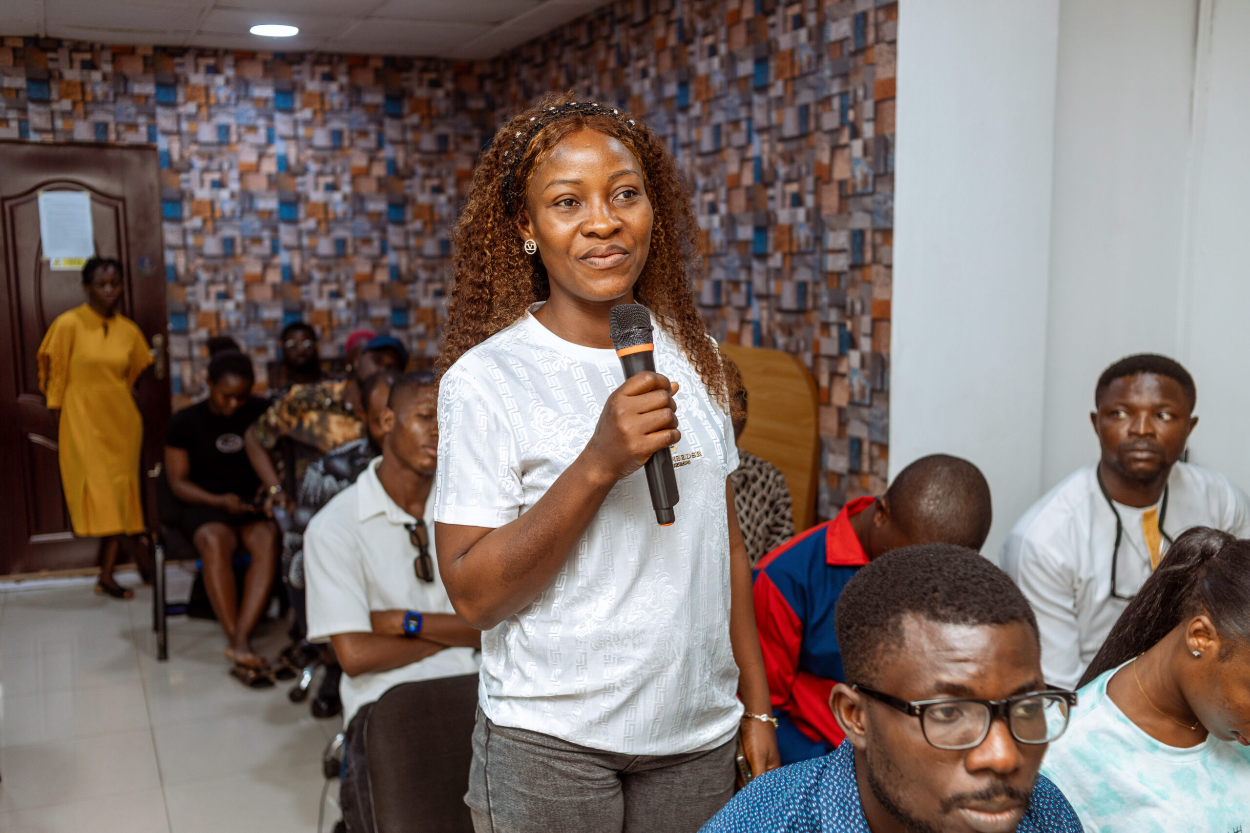 Audience member asking a question about AI risks during the AMA session at GenniBit MeetUp Nigeria.