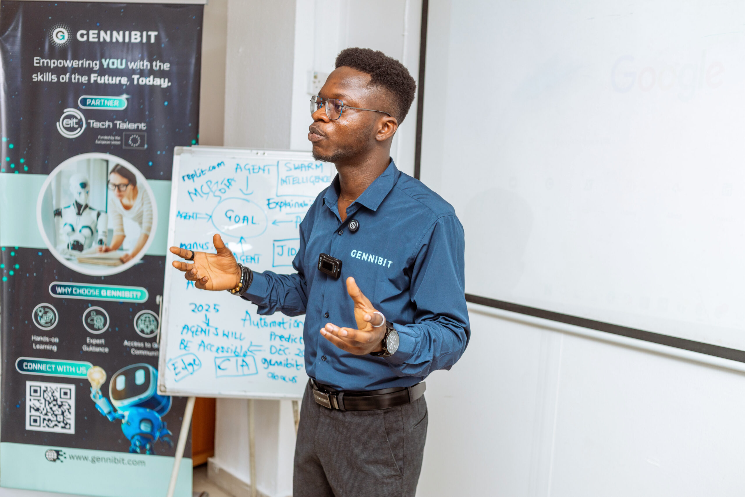GenniBit CEO Adeleke Samuel facilitating a hands-on session on using AI agents like Manus and ChatGPT during the workshop.